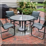 L02. Round patio dining table and 4 chairs. 26&rdquo;h x 48&rdquo;w 